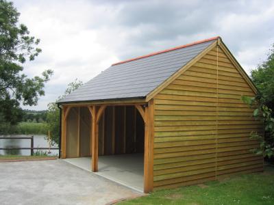 6.0m x 5.4m (20' x 18') 2 bay Carriage House with 3.6m x 5.4m (12' x 18') attached Garage with 35° pitch pantile roof