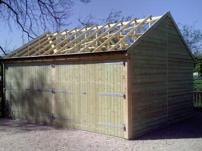 Pic 95. 6.0m x 4.8m 2 bay Carriage House with barn doors and roof awaiting tiling