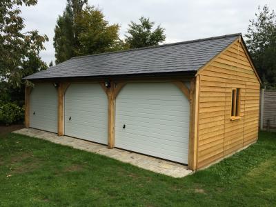 Pic 65. 9.0m x 5.4m 3 bay Carriage House with slate roof and metal sectional doors