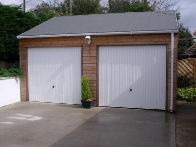 Pic 31. 6.0m x 4.8m Garage with felt roof & doors in side wall elevation