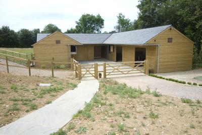 Pic 6. 2 Loose Boxes, Corner Box, Corner Hay Store, Feed Room and Tack Room - Note slate roof